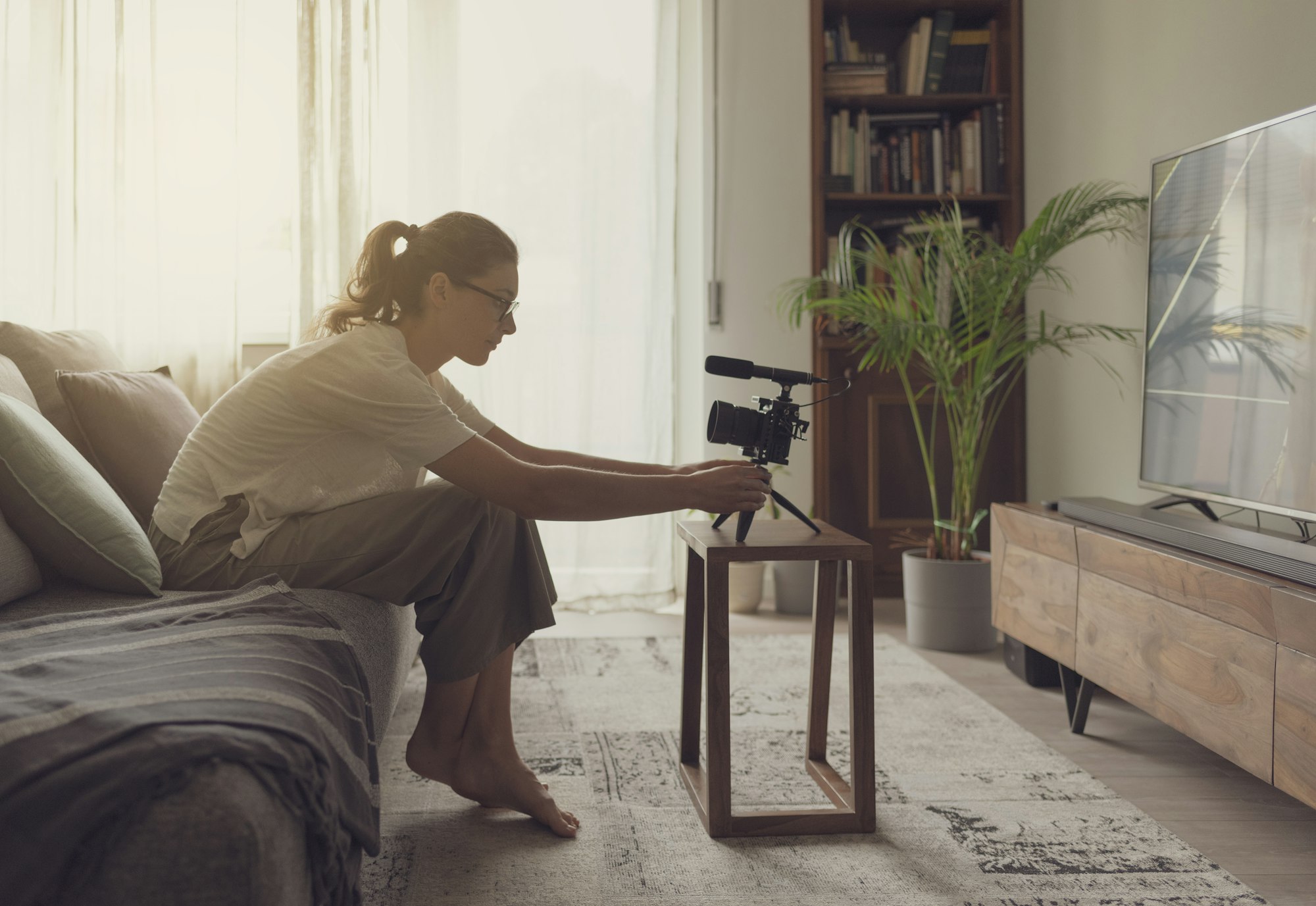 Youtuber recording a video in the living room